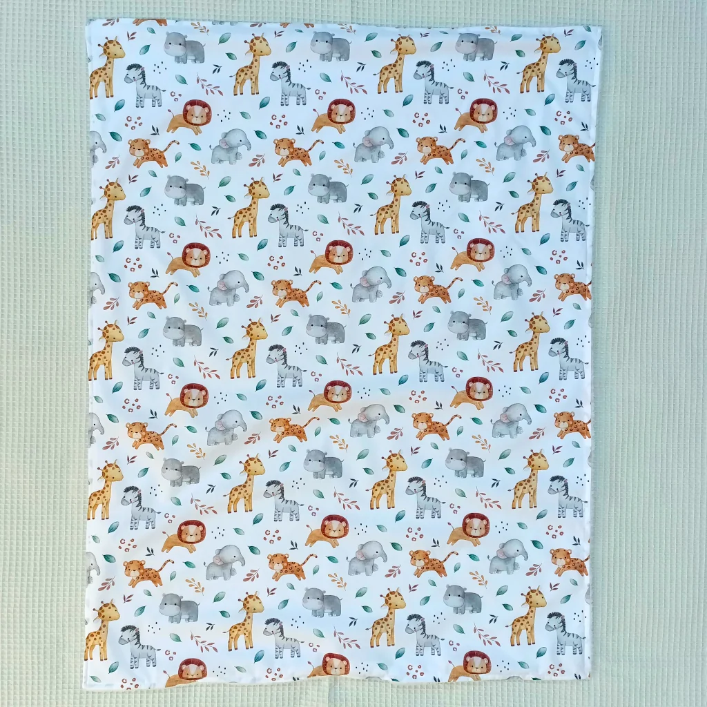 Manta bebé artesanal 90x70 hecha a mano handmade animales de África anverso