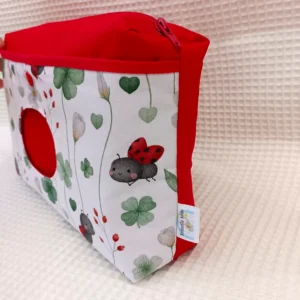 Pañalera artesanal neceser hecho a mano personalizado handmade mariquitas y flores de lado